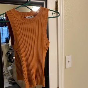 Brand is Double Zero, peachy rust color, size small